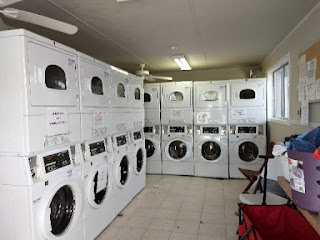 Pecan Park Riverside RV Laundry white washers and dryers