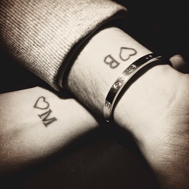 Heart or name matching tattoos for couples