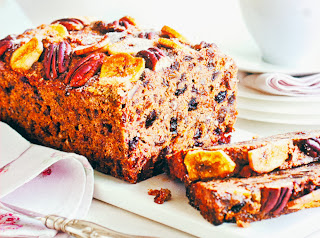 Date, Banana and Rum Loaf: Date and banana bread topped with dried banana and pecan nuts, shown sliced