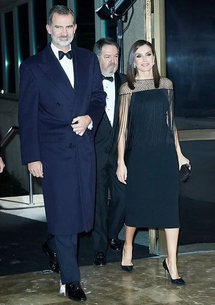 Queen Letiza in Carolina Herrera wool coat and Carolina Herrera lace fringed dress, Bottega Veneta clutch. Magrit pumps