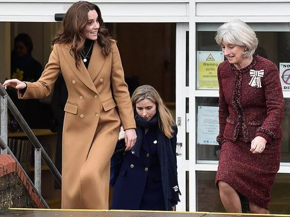 Kate Middleton wore massimo dutti cashmere wool camel coat. Kate Middleton wore Zara animal print skirt at Ely and Careau Children's Centre