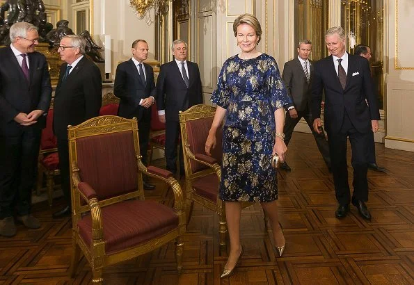 Queen Mathilde wore Dries Van Noten A-Line metallic floral jacquard midi dress. European Union, and the foreign diplomats