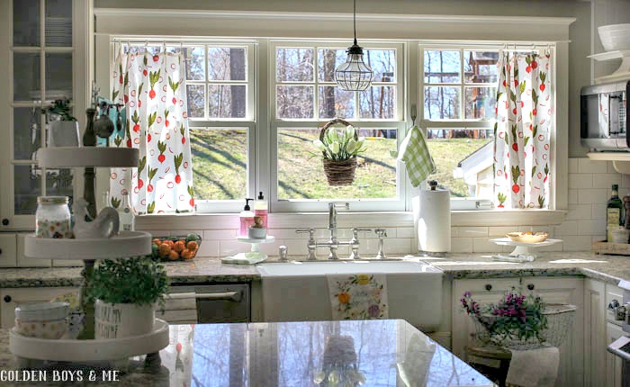 Farmhouse sink in spring kitchen with flour sack curtains