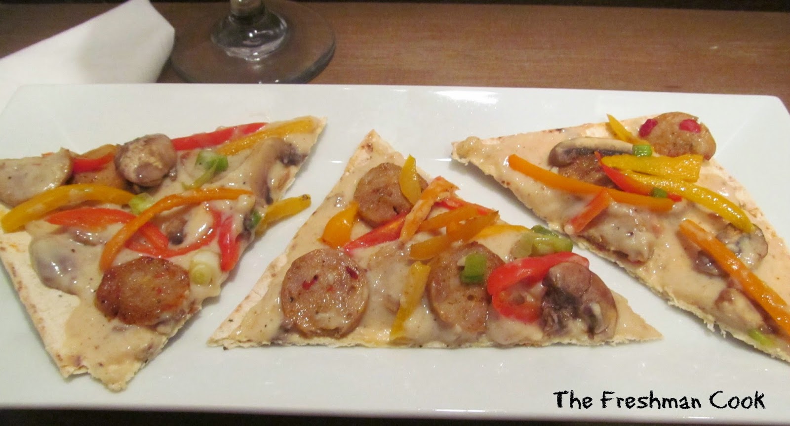 Flatbread appetizer with sausage and mushroom