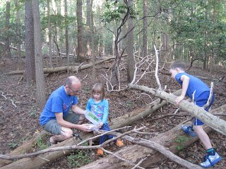 Opening a geocache box in the woods