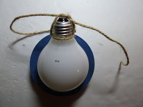 Recycled light bulb ornament for breast cancer awareness