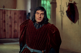 Laurence Olivier as Richard walking with a hunch in Richard III movieloversreviews.filminspector.com