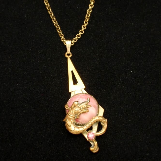 http://www.ebay.com/itm/Dragon-Serpent-Pendant-Necklace-Vintage-Glass-Rhinestone-/291009736670