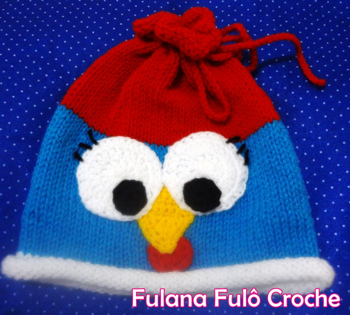 http://www.fulanafulocroche.com.br/2014/07/touca-em-trico-galinha-pintadinha.html