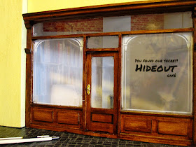 Modern dolls' house miniature cafe front.