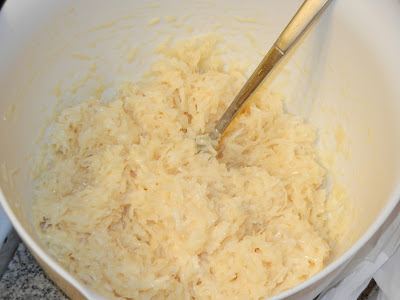 coconut mixture in a bowl with a fork to the right 