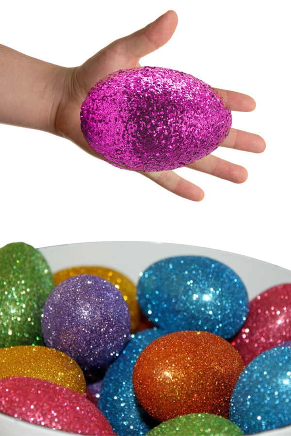 Decorate the most sparkly Easter eggs using glitter!  This decorating idea is really easy, making it great for kids of all ages! #glittereastereggs #glittereastereggsdiy #glittereggs #glittereggseaster #rainboweastereggs #rainboweggs #rainbowglitter #eggdecorating #eggdecoratingforkids #growingajeweledrose