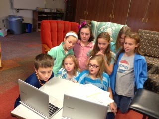 Kids Gathered Around Laptop