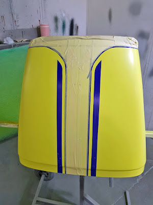 Nose cone sprayed in Sulfur Yellow, then masked with blue fine line tape, where the yellow stripes will be! Confusing!