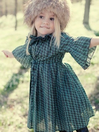 little girl Louise: blond hair, brown eyes
