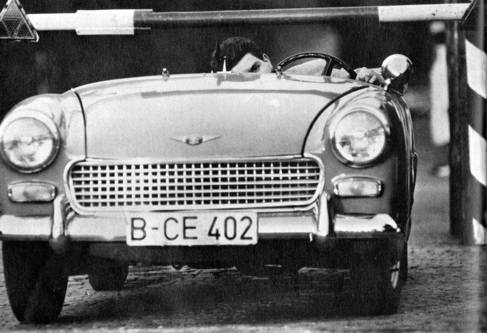 Heinz Meixner defects from East Germany by driving through Checkpoint Charlie, 1963