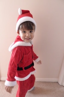 Small child in a Santa outfit
