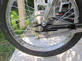 Rear wheel with brake rod and tension bar