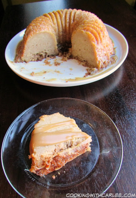 This apple bundt is full of fresh apple flavor. Served with cider caramel sauce, this is the perfect fall treat! #appleweek slice of apple bundt drizzled with caramel in front of rest of cake