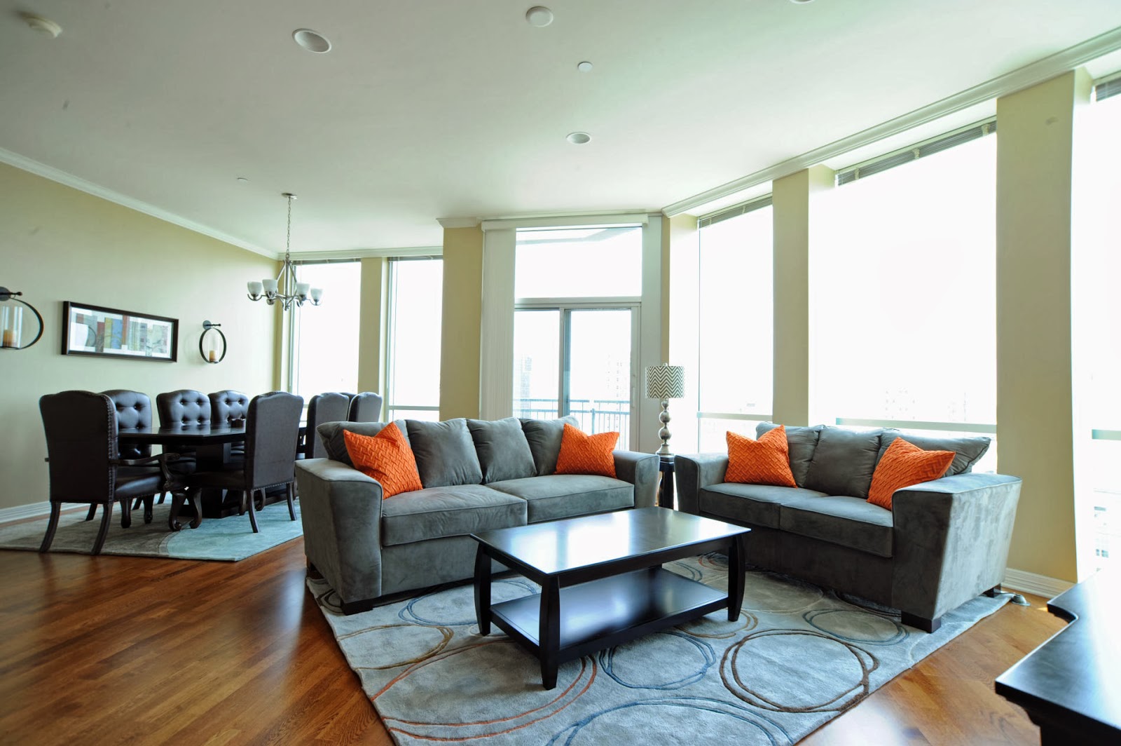Grey Lounge Area With Pops Of Orange 