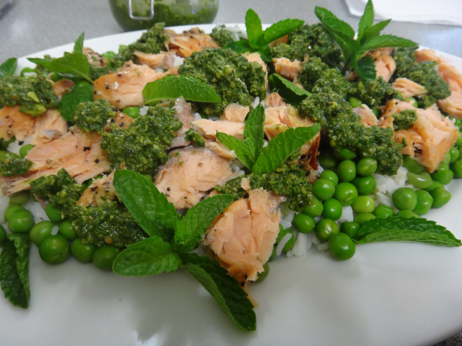 Hot smoked salmon salad with pesto, peas and mint