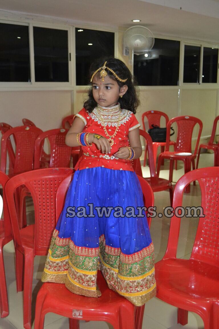 red lehenga and blue suit combination