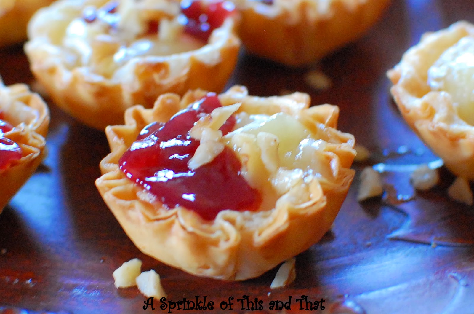 A Sprinkle of This and That Raspberry Brie Tartlets