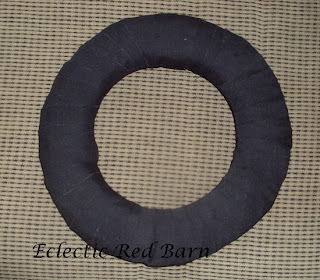 completely wrapped straw wreath with black fabric