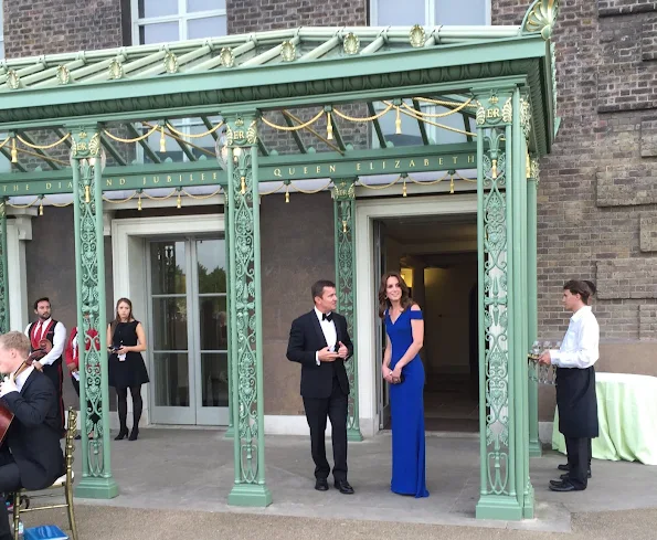 Kate Middleton attended the TeamSportsAid 40th anniversary dinner at Kensington Palace. Kate Middleton wore Roland Mouret Nansen Crepe Dress, Style PRADA Clutch