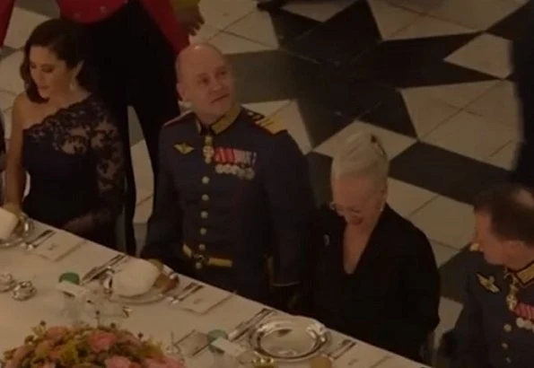 Crown Princess Mary wore Julie Fagerholt Heartmade Benina cape and Lasse Spangenberg gown, J Furmini clutch. Crown Prince Frederik
