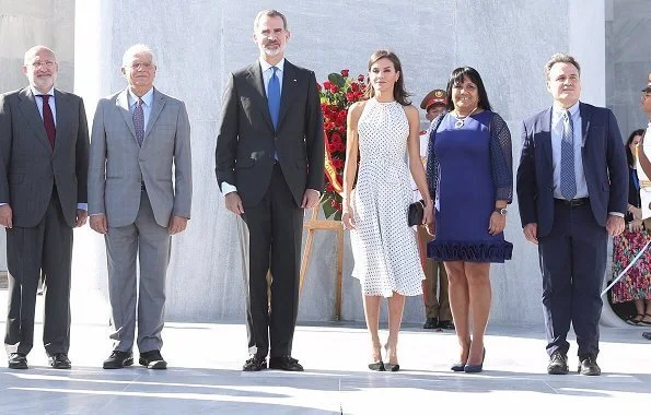 Queen Letizia wore Carolina Herrera polka dot silk dress, Steve Madden suede pumps and carried Nina Ricci Arc clutch