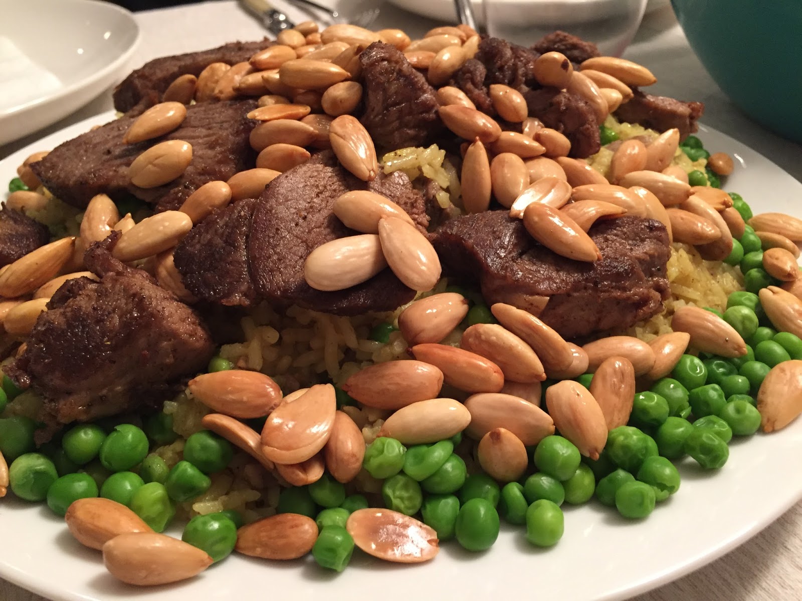 Here and There Lamb Ouzi with Rice, Almonds and Peas