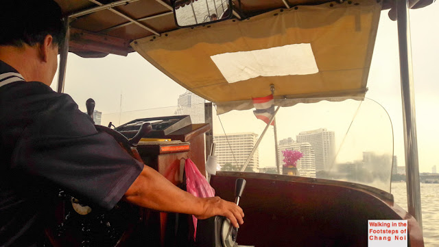 The captain of our boat on the Chao Phraya River in Bangkok, Thailand