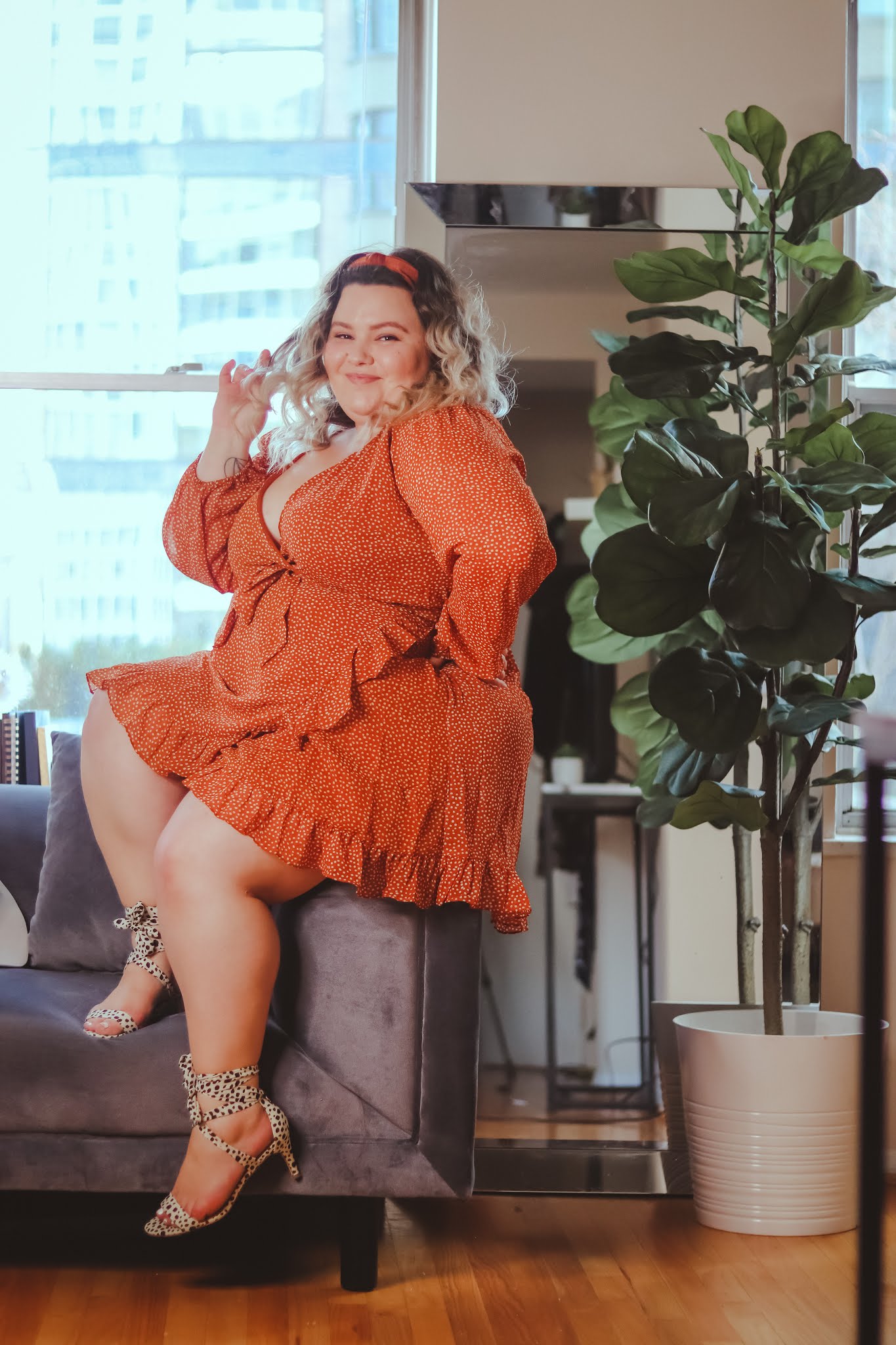 Chicago Plus Size Petite Fashion Blogger, influencer, YouTuber, and model Natalie in the City shares her latest work from home outfit Adore Me's ready to wear ruffle mini dress.