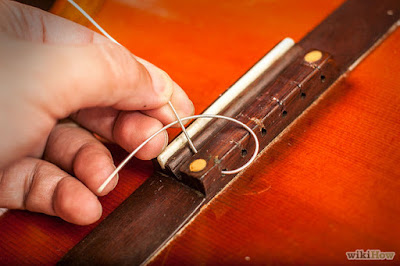 Cách thay dây đàn guitar Classical