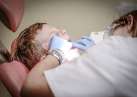 A child teeth examined by a dentist. A child teeth examined by a dentist.