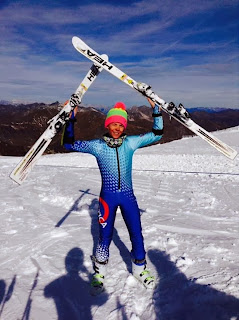 skis above head blue speed suit