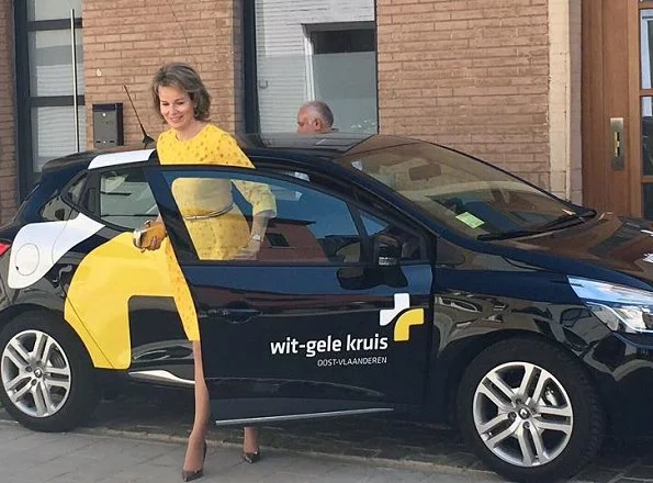 Queen Mathilde visited the Wit-Gele Kruis (White-Yellow Cross) in Gent. Queen wore Natan Dress and Delphine Nardin Gold Earrings
