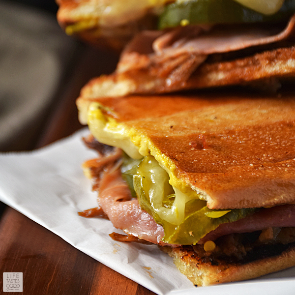 No need to travel to South Florida to enjoy a Cuban sandwich. Make this Pulled Pork Cuban Sandwich | by Life Tastes Good at home using leftover pulled pork, fresh homemade pickles, your favorite ham and cheese, and soft, fresh baked bread from the bakery. It's easy and full of flavor! #LTGrecipes