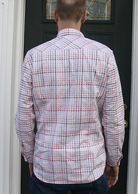 A pink and white plaid men's shirt made using the Thread Theory Fairfield Button-Up Shirt sewing pattern.