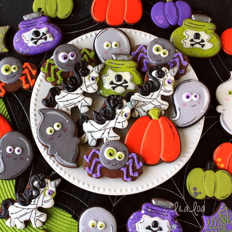 Halloween decorated sugar cookies -- mummy unicorns, spiders, ghosts, pumpkins and potions