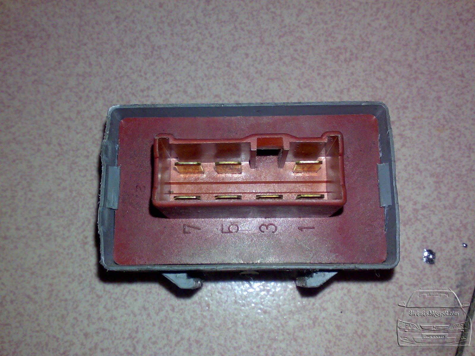 2. Looking at the relay, it is secured with 2 slots on each end