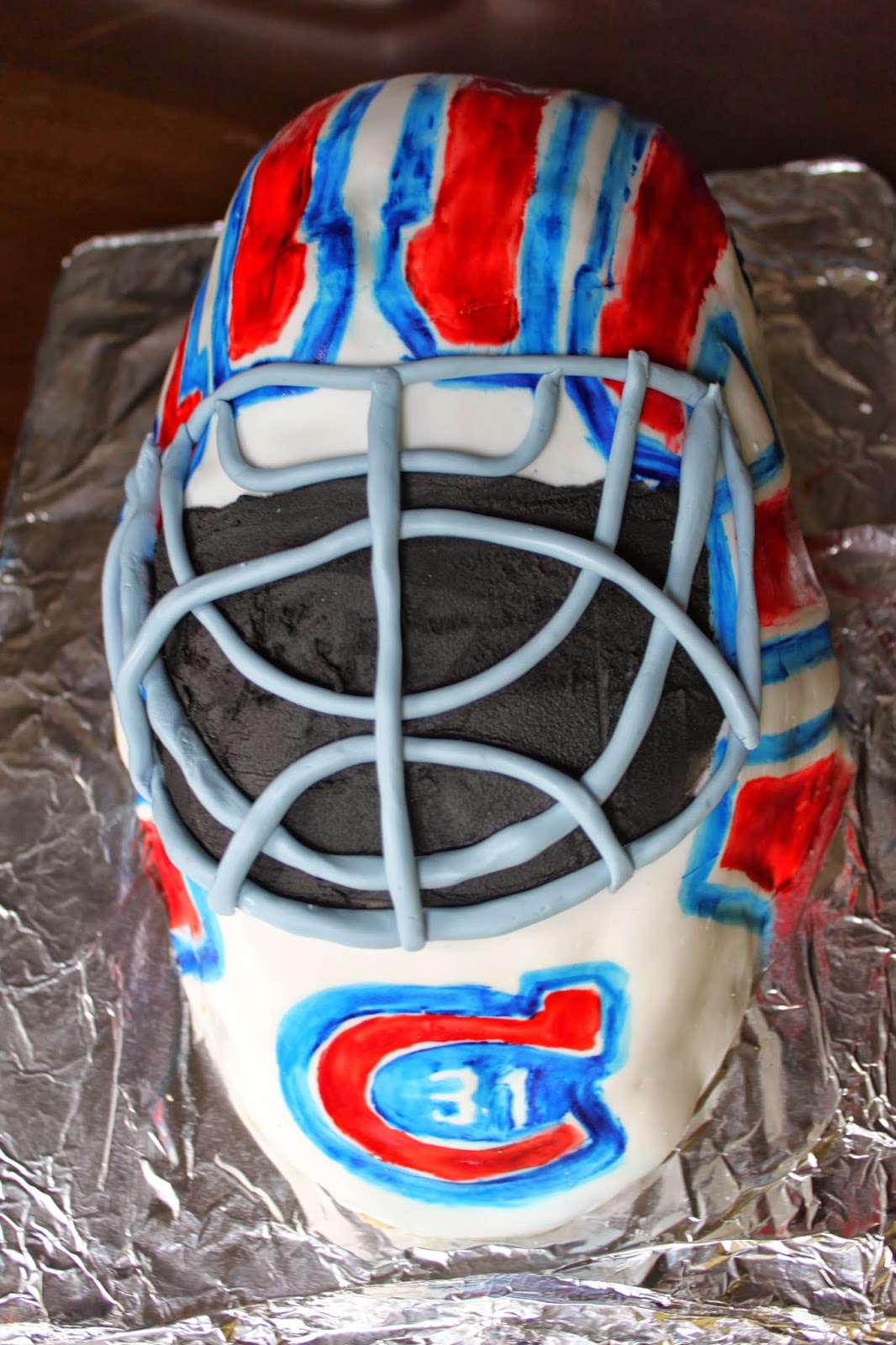 Sweet Deliciousness Marshmallow Fondant Hockey Goalie Mask Cake