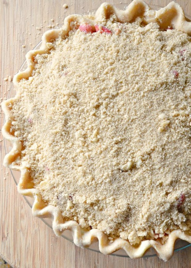 Strawberry Rhubarb Pie covered with crumble topping from Serena Bakes Simply From Scratch.