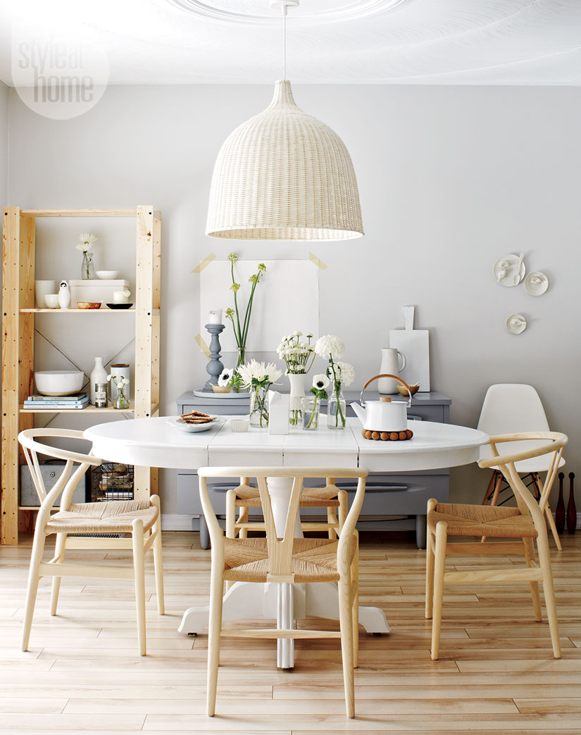 white and blue dining room decor with light wood floros and chairs