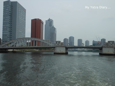 Bridge and buildings together during the Sumida River cruise, Tokyo - Japan