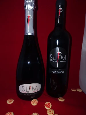 slim wine bottle on red back ground 