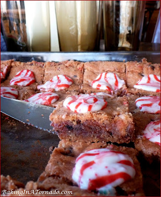 Peppermint Stick Cookie Bars, crunchy cookie bars with crushed candy canes and cookies | Recipe developed by www.BakingInATornado.com | #recipe #bake