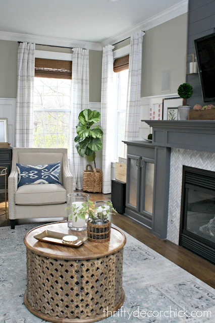 Gray fireplace in family room with built in storage