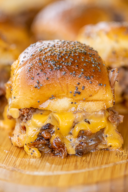 Beef & Cheddar Sliders - perfect for watching football, parties or a quick lunch and dinner. Seriously delicious!! Hawaiian rolls, deli roast beef, bbq sauce, cheddar cheese, butter, dijon mustard, worcestershire, brown sugar and poppy seeds. Can assemble ahead of time and bake when ready to serve. You might want to double the recipe - these don't last long in our house! #sliders #superbowl #tailgating Beef & Cheddar Sliders - perfect for watching football, parties or a quick lunch and dinner. Seriously delicious!! Hawaiian rolls, deli roast beef, bbq sauce, cheddar cheese, butter, dijon mustard, worcestershire, brown sugar and poppy seeds. Can assemble ahead of time and bake when ready to serve. You might want to double the recipe - these don't last long in our house! #sliders #superbowl #tailgating